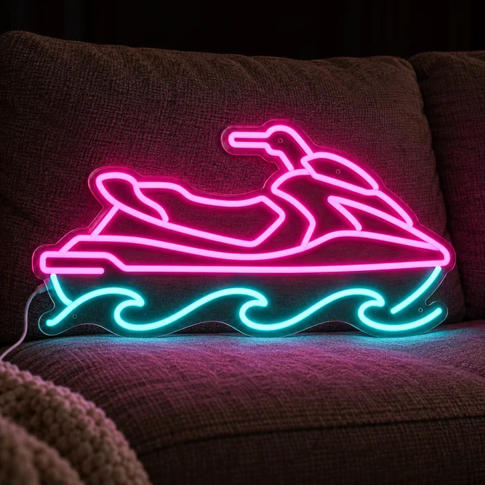Vesijetti neon LED -kyltti kodikkaalla sohvalla tyynyjen ja huovan välissä