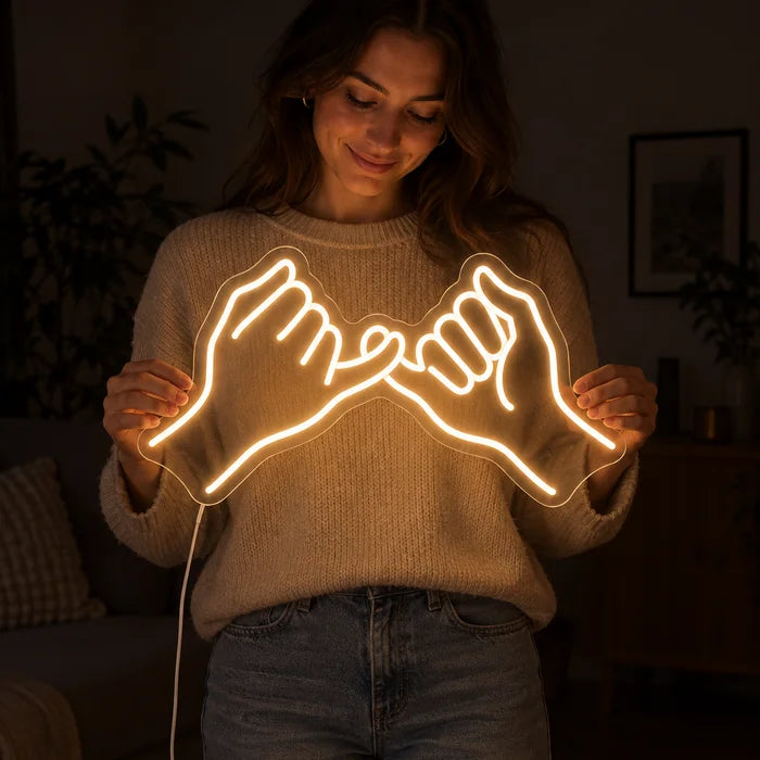 Pinky Promise Neon LED Sign held by a woman, showing its size compared to her body