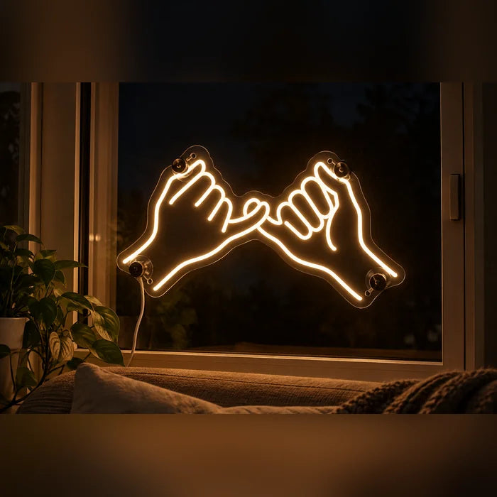 Pinky Promise Neon LED Sign in the window of a cosy living room in the evening