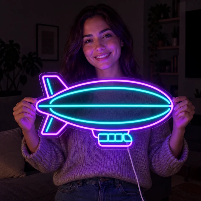 Airship Neon LED Sign held by a smiling woman against a dark background