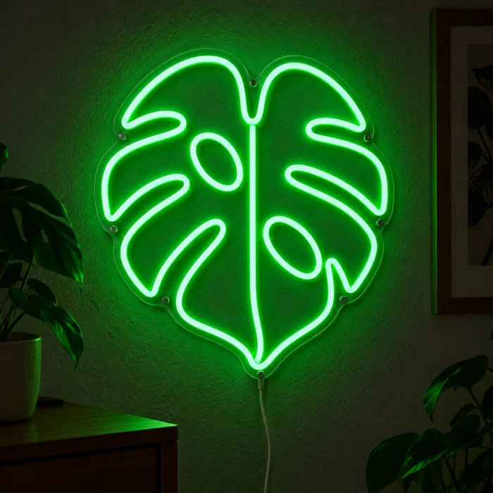 Monstera Leaf Neon LED Sign glowing on a dark wall, close-up with connection cable