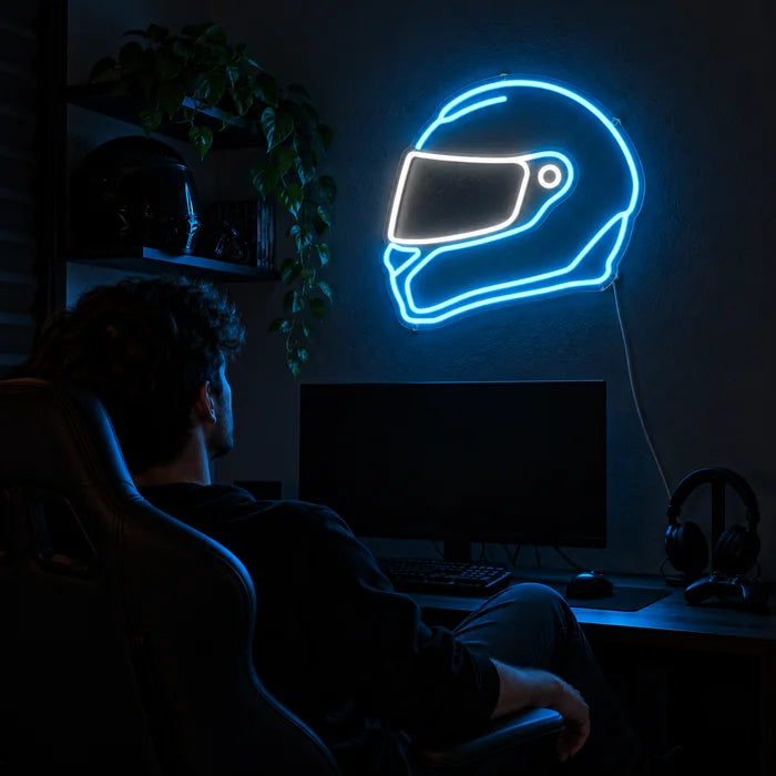 Neon Racing Helmet Neon LED Sign above a gaming desk, a gamer in a gaming chair in front of it
