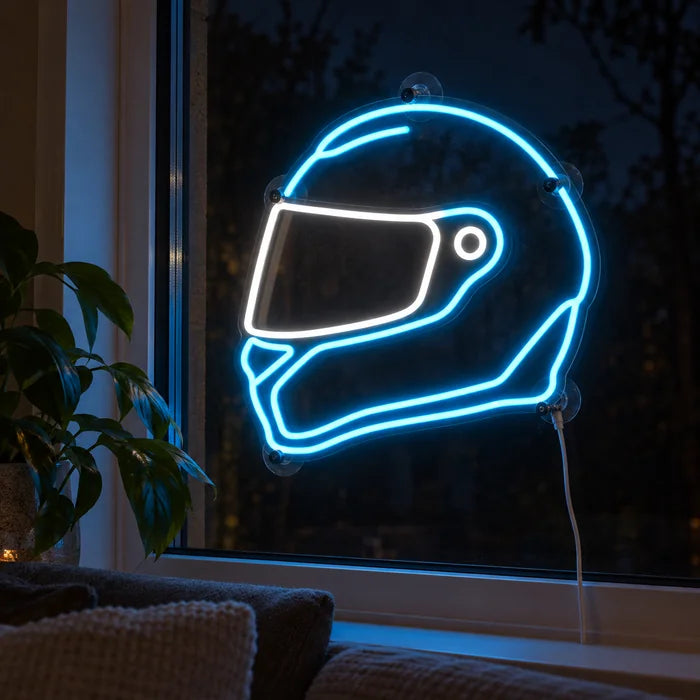 Neon Racing Helmet Neon LED Sign in the window of a cosy living room in the evening