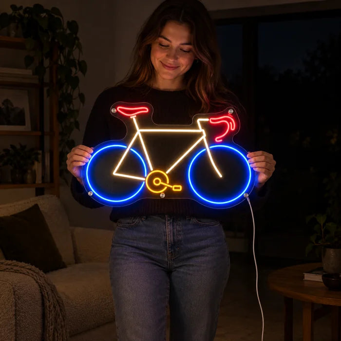 Neon Road Bike Neon LED Sign held by a woman, showing its size compared to her body