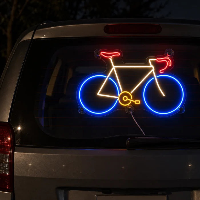 Neon Road Bike Neon LED Sign on the rear window of a car at night