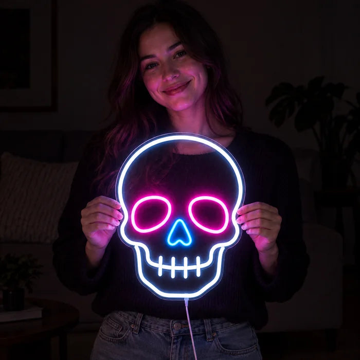 Neon Skull Neon LED Sign held by a smiling woman against a dark background