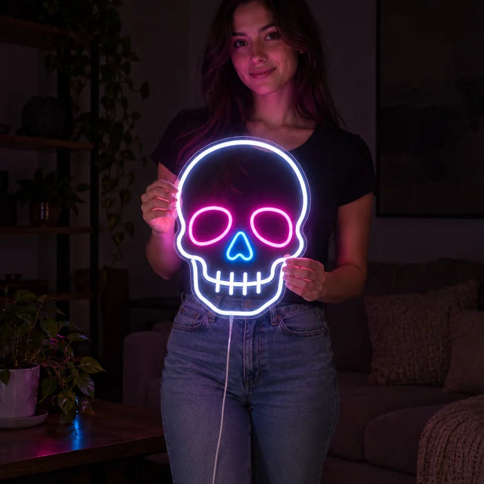 Neon Skull Neon LED Sign held by a woman, showing its size compared to her body
