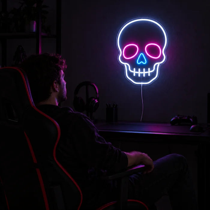 Neon Skull Neon LED Sign above a gaming desk, a gamer in a gaming chair in front of it