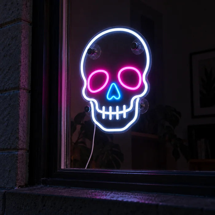 Neon Skull Neon LED Sign in a window, seen from the street at night
