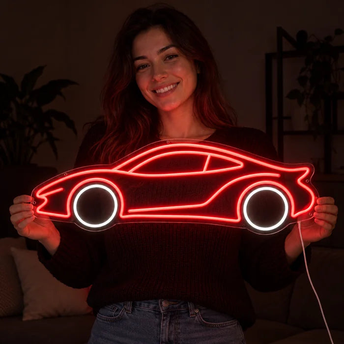 Neon Sports Car Neon LED Sign held by a smiling woman against a dark background