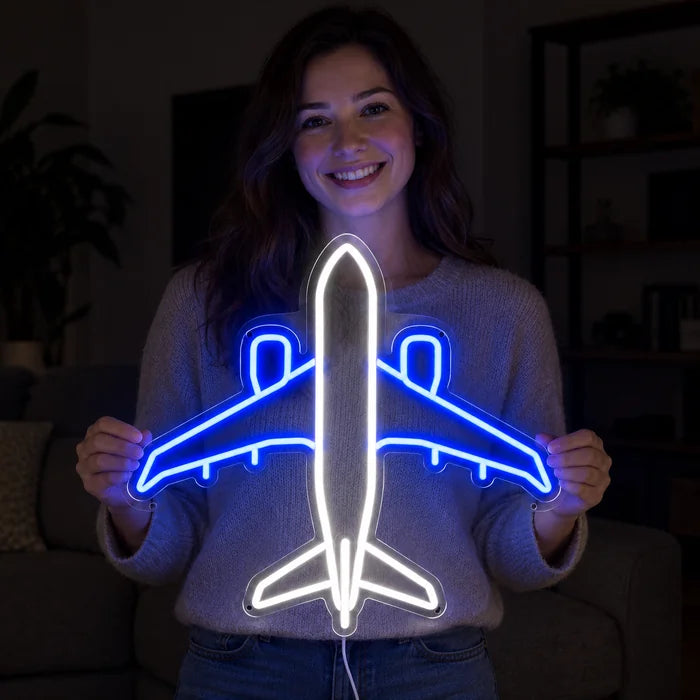 Passenger Plane Neon LED Sign held by a smiling woman against a dark background