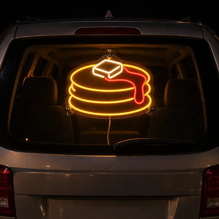Pancakes Neon LED Sign on the rear window of a car at night
