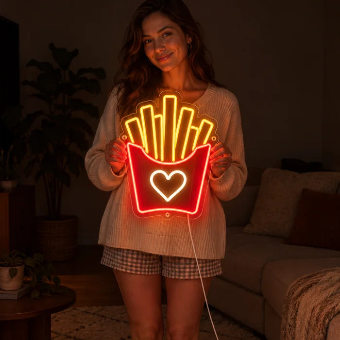 Fries Love Neon LED Sign held by a woman, showing its size compared to her body