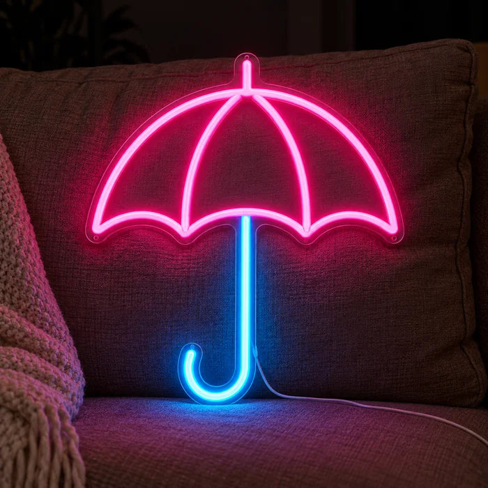 Umbrella Neon LED Sign on a cosy sofa between cushions and a throw