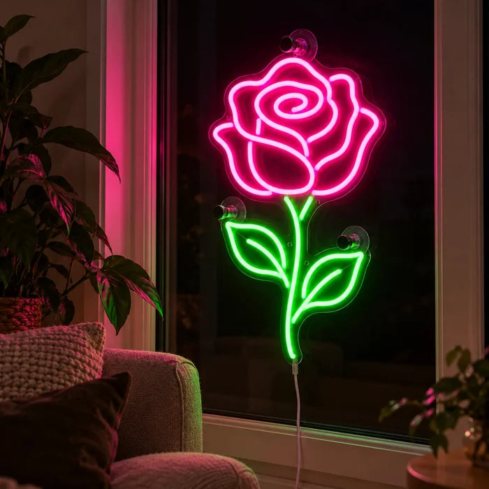 Rose Light Neon LED Sign in the window of a cosy living room in the evening