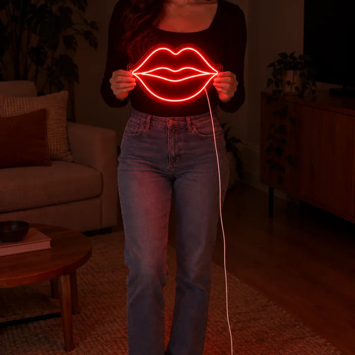 Red Lips Neon LED Sign held by a woman, showing its size compared to her body