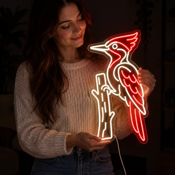Red Woodpecker Neon LED Sign held by a woman, showing its size compared to her body
