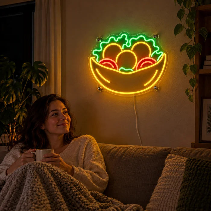 Salad Bowl Neon LED Sign on a living room wall, a person relaxing on the sofa in front of it