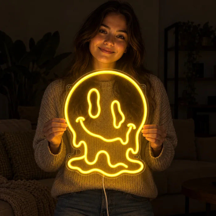 Melting Skull Neon LED Sign held by a smiling woman against a dark background