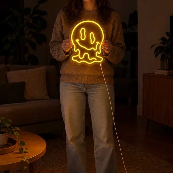 Melting Skull Neon LED Sign held by a woman, showing its size compared to her body
