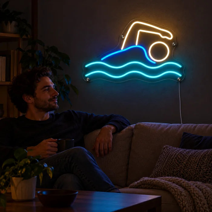Swimmer Neon LED Sign on a living room wall, a person relaxing on the sofa in front of it