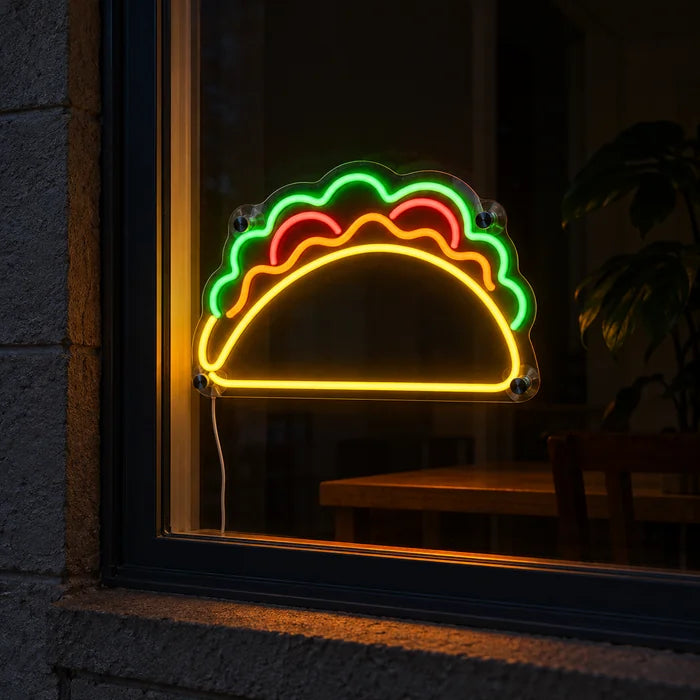 Taco Time Neon LED Sign in a window, seen from the street at night