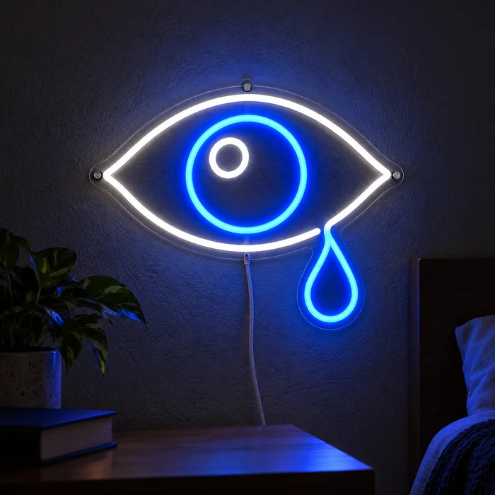 Tåreøje neon LED skilt lysende på en mørk væg, nærbillede med tilslutningskabel
