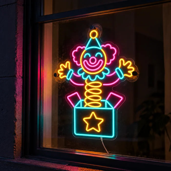 Surprise Clown Neon LED Sign in a window, seen from the street at night
