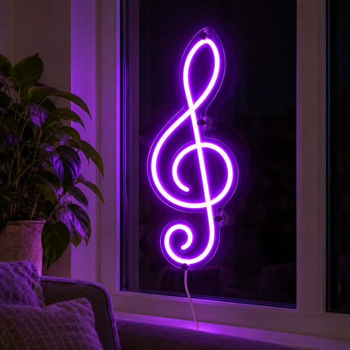 Treble Clef Neon LED Sign in the window of a cosy living room in the evening