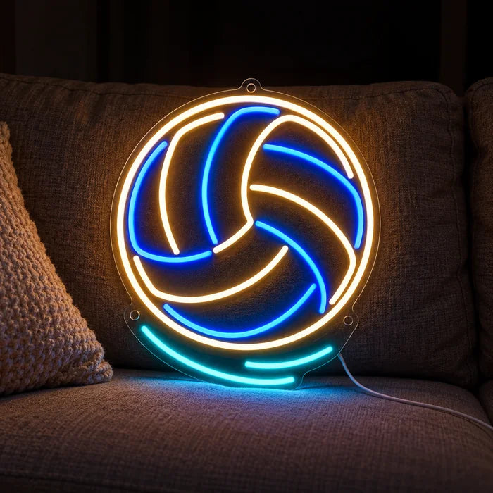 Volleyball Neon LED Sign on a cosy sofa between cushions and a throw