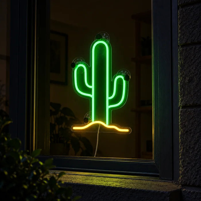 Desert Cactus Neon LED Sign in a window, seen from the street at night
