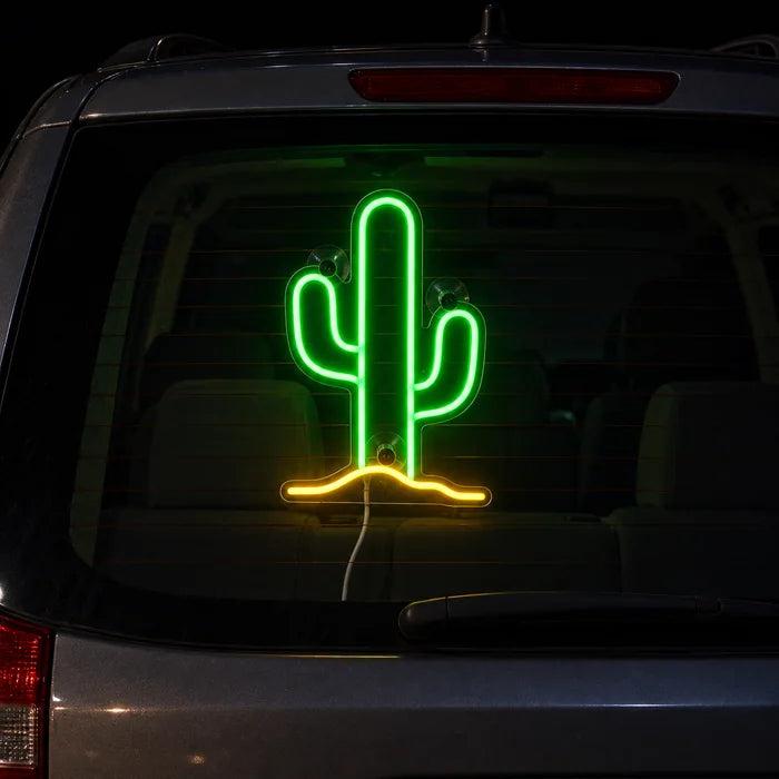 Desert Cactus Neon LED Sign on the rear window of a car at night
