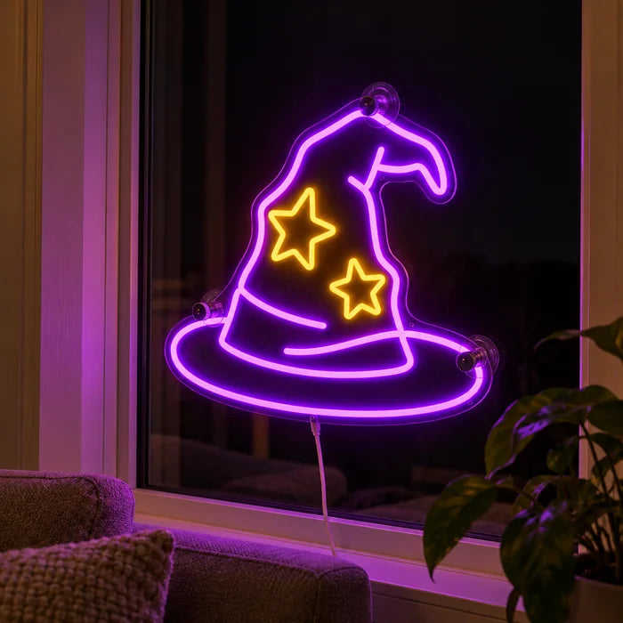 Wizard Hat Neon LED Sign in the window of a cosy living room in the evening